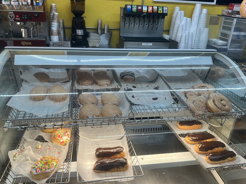 Fried chicken and donuts on a counter.